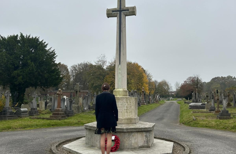 Aphra Brandreth MP laying a wreath