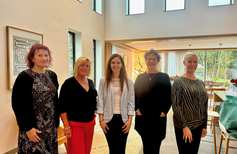 Aphra Brandreth MP with Bells and some of the team at Maggie's