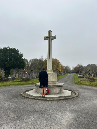 Aphra Brandreth MP laying a wreath